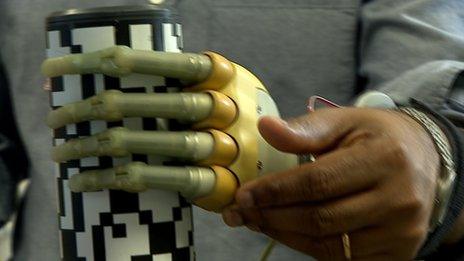 Robot hand holding cup