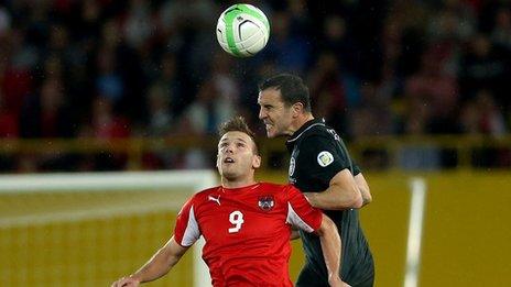 John O'Shea outjumps Andreas Weimann in Vienna