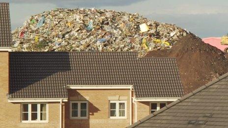 House with rubbish behind it - archive image