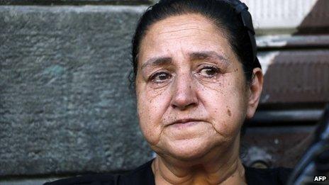 A woman weeps at the funerals for three Maaloula residents in Damascus (10 September 2013)