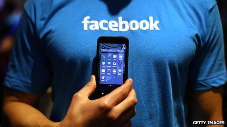 Facebook t-shirt and phone