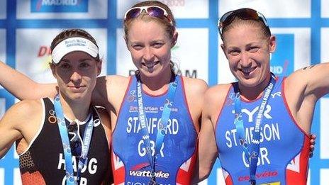 Non Stanford on the podium after winning the Madrid ITU world series triathlon event flanked by Germany's Anne Haug and Great Britain's Jodie Stimpson