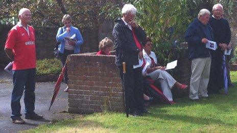 Well-wishers wearing red in honour of Cliff Morgan