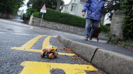 A toy car in the parking space