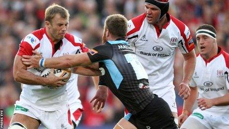 Ulster flanker Roger Wilson is tackled by Glasgow's Tyrone Holmes