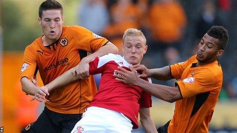 Alex Pritchard grapples with Matt Doherty and David Davis