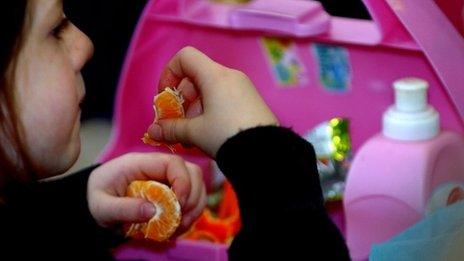 Child eating packed lunch