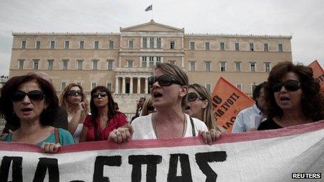 Protesters shout slogans during a rally by high school teachers against layoffs in their sector in front of the parliament in Athens (16 September)