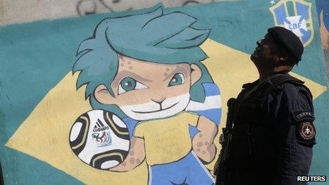 A UPP officer on patrol in Ladeira dos Guararapes favela in Rio on 29 April, 2013