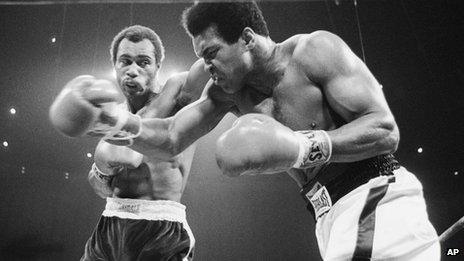 Muhammad Ali, right, winces as Ken Norton hits him with a left to the head during their re-match at the Forum in Inglewood, California 10 September 1973