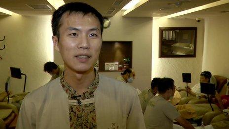 Tim Tsai, 29, now wears a masseur's uniform