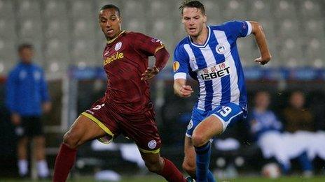 Nick Powell chases the ball for Wigan