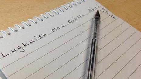 Mr Mac Giolla Bhrighde's name written across a notebook