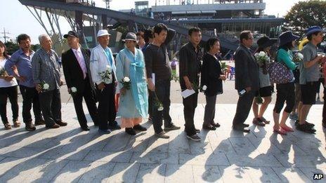 North Korean refugees and their family members wait to pay their respects to their ancestors in North Korea during a ceremony to mark the Korean version of Thanksgiving Day, at the Imjingak Pavilion, near the demilitarized zone of Panmunjom, in Paju, South Korea, Thursday 19 September, 2013.