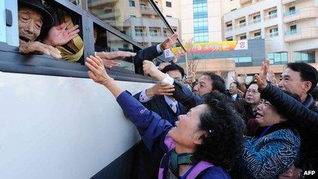 File photo (1 November 2010) shows North Koreans (on bus) waving to their South Korean relatives as they bid farewell following their three-day separated family reunion meeting at the Mount Kumgang resort on the North's south-eastern coast