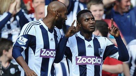 Stephane Sessegnon celebrates his goal with Nicolas Anelka