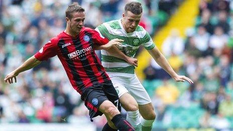 Chris Millar and Adam Matthews vie for the ball at Celtic Park