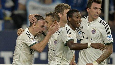 Bayern's Franck Ribery of France (left) is celebrated by team-mates after scoring during the German soccer Bundesliga match between FC Schalke 04 and Bayern Munich