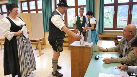 Germans wearing traditional clothes vote in in Bad Hindelang, Bavaria, 23 September