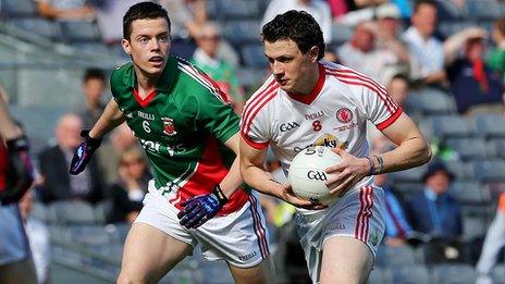 Stephen Coen of Mayo closes in on Tyrone's Ronan Nugent at Croke Park