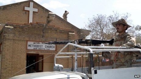 Pakistani soldiers stand guard outside a church in Quetta on 22 September, following a twin-suicide bomb attack on Christians in Peshawar.