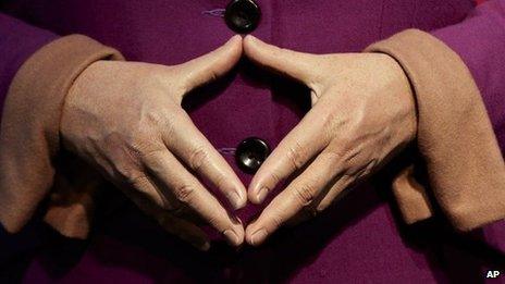 The hands of Angela Merkel, on her waxwork dummy at Germany's Madame Tussauds