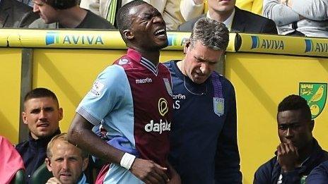 Christian Benteke limps off at Carrow Road