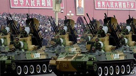 A convoy of armoured vehicles heads towards Tiananmen Square on Friday, Oct. 1, 1999 in Beijing as part of the celebrations for the 50th anniversary of China under communist rule.