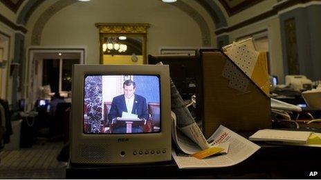 Senator Ted Cruz is seen on a television screen in the Senate Press Gallery during the tenth hour of his speech on the Senate floor 25 September 2013