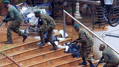 Soldiers approach the Westgate shopping centre in Nairobi