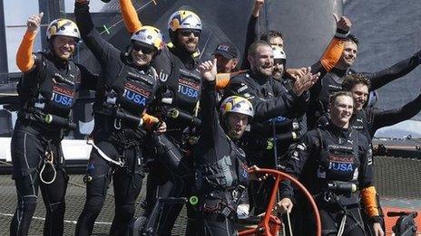 Oracle Team USA crew, including skipper Jimmy Spithill and tactician Sir Ben Ainslie, celebrate after winning the 19th race against Emirates Team New Zealand