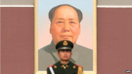 File photo: Paramilitary guard in front of a portrait of Mao Zedong in Tiananmen Square, 15 November 2012