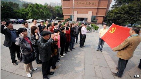 Residents gather to sing red songs at a park in Chongqing on 20 April 2011