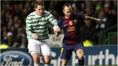 Andres Iniesta in action for Barcelona with Kris Commons