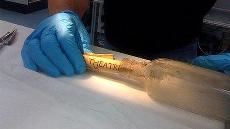 The bottle found at Durham Cathedral is examined