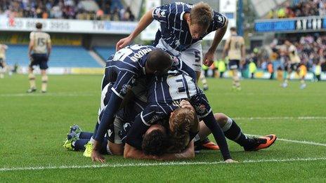 Millwall's players celebrate scoring against Leeds