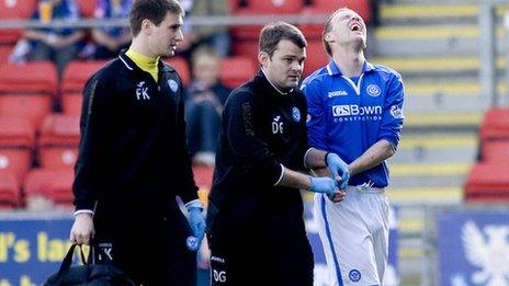 St Johnstone defender Steven Anderson is helped off the pitch