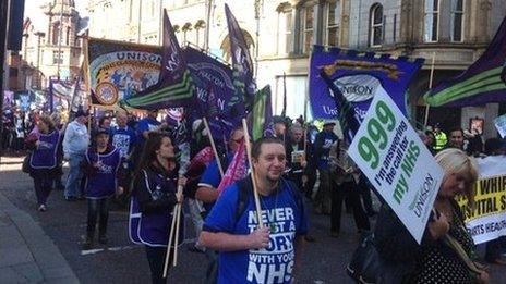 Protesters carrying banners and placards in Manchester