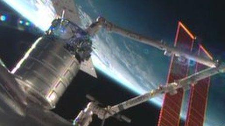 Cygnus cargo ship docking with International Space Station