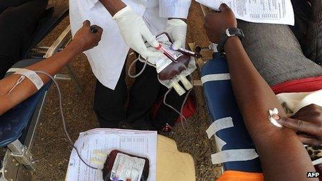 People donate blood on September 25, 2013 for victims of a deadly four-day siege that left more than 60 people dead and close to 200 injured after militants stormed the upmarket Westgate mall.