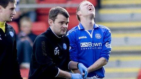 Steven Anderson is led from the field after suffering his injury