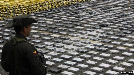 Cocaine seized from the criminal gang Los Urabenos is displayed by the Colombian police on 20 April, 2013