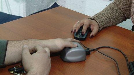 Man being fingerprinted for the AFA card