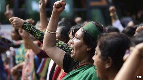 Bangladeshi social activists shout slogans in celebration outside the International Crimes Tribunal court in Dhaka on October 1, 2013