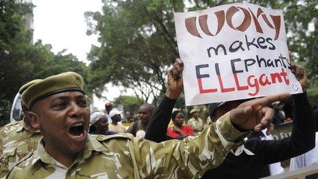 A Kenya Wildlife Service rangers leads a group of wildlife conservationists during a protest in Nairobi on 29 June 2013