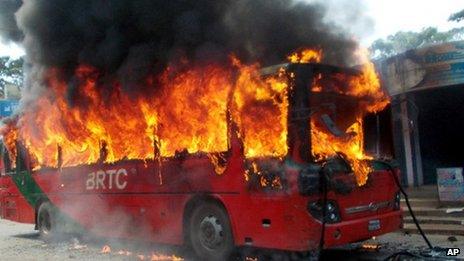 A bus set on fire in Chittagong by activists of the opposition Bangladesh Nationalist Party (BNP) in protest against Salauddin Quader Chowdhury's death sentence