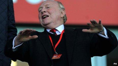 Lord Kinnock celebrating at a football match