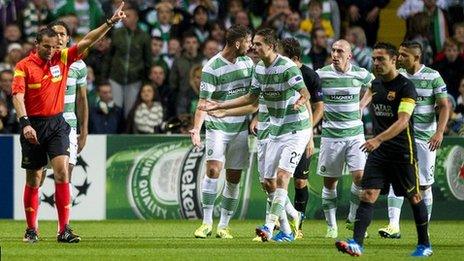 Referee Stephane Lannoy orders Celtic captain Scott Brown off against Barcelona