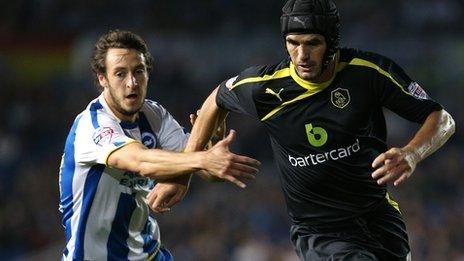 Miguel Llera of Sheffield Wednesday looks to get away from William Buckley of Brighton