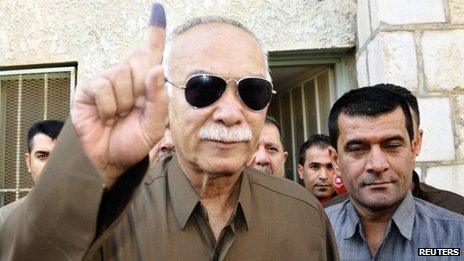 Nawshirwan Mustafa shows an ink-stained finger after voting on 21 September 2013